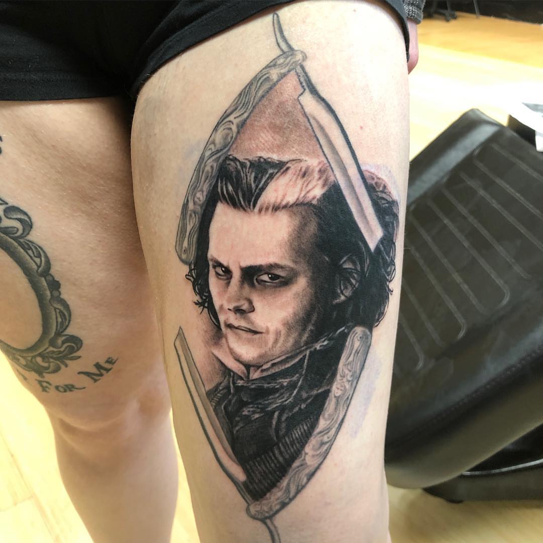Portrait of a man realism tattoo on the thigh by Zac Presley