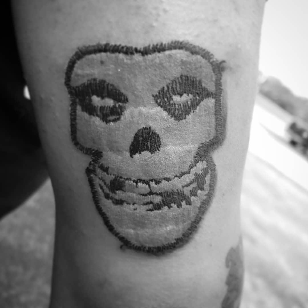 Skull black and grey tattoo on the forearm by Kayla Linton