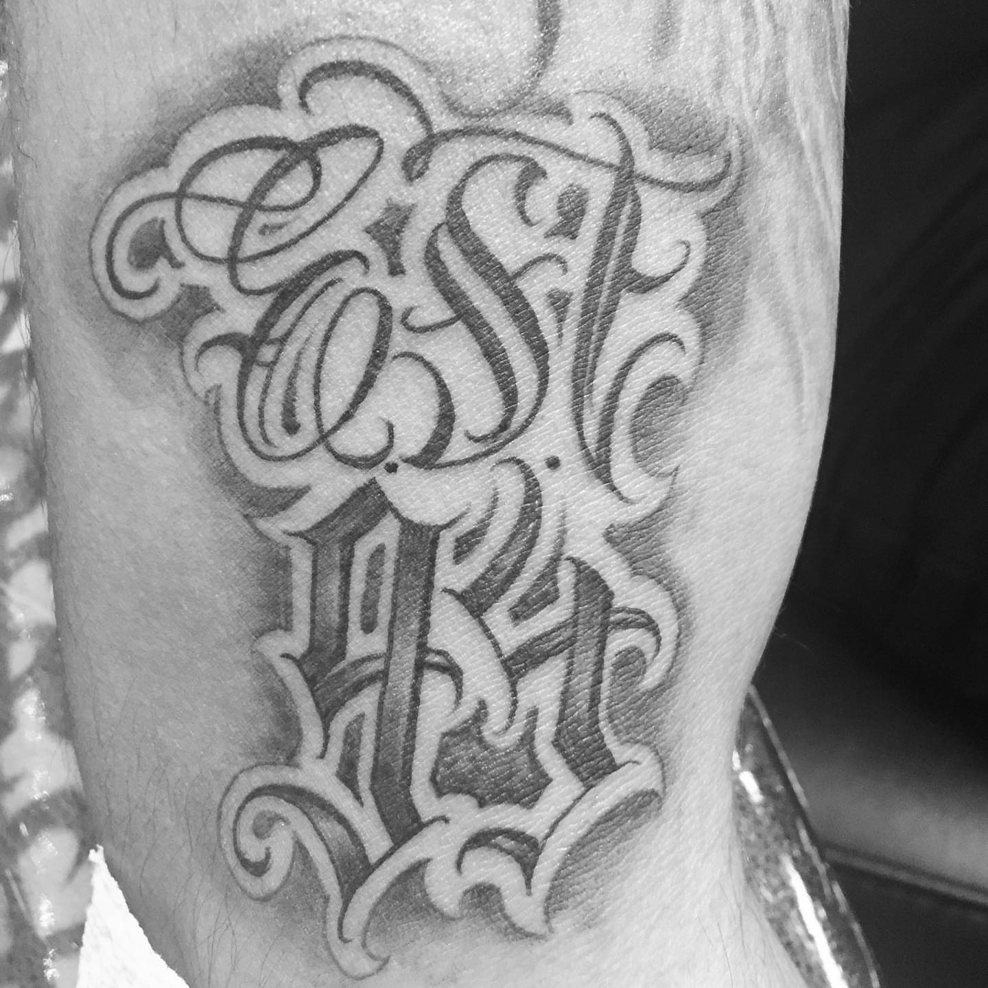 Tattoo by @jokertattoos — lettering_script, ornamental
