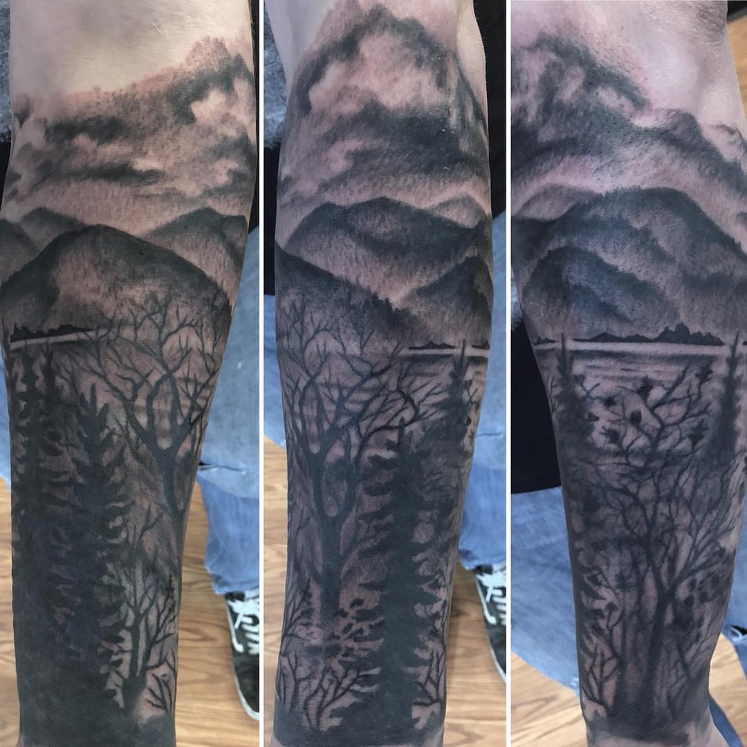 Mountain landscape realism tattoo on the forearm by Strange Brew Tattoo