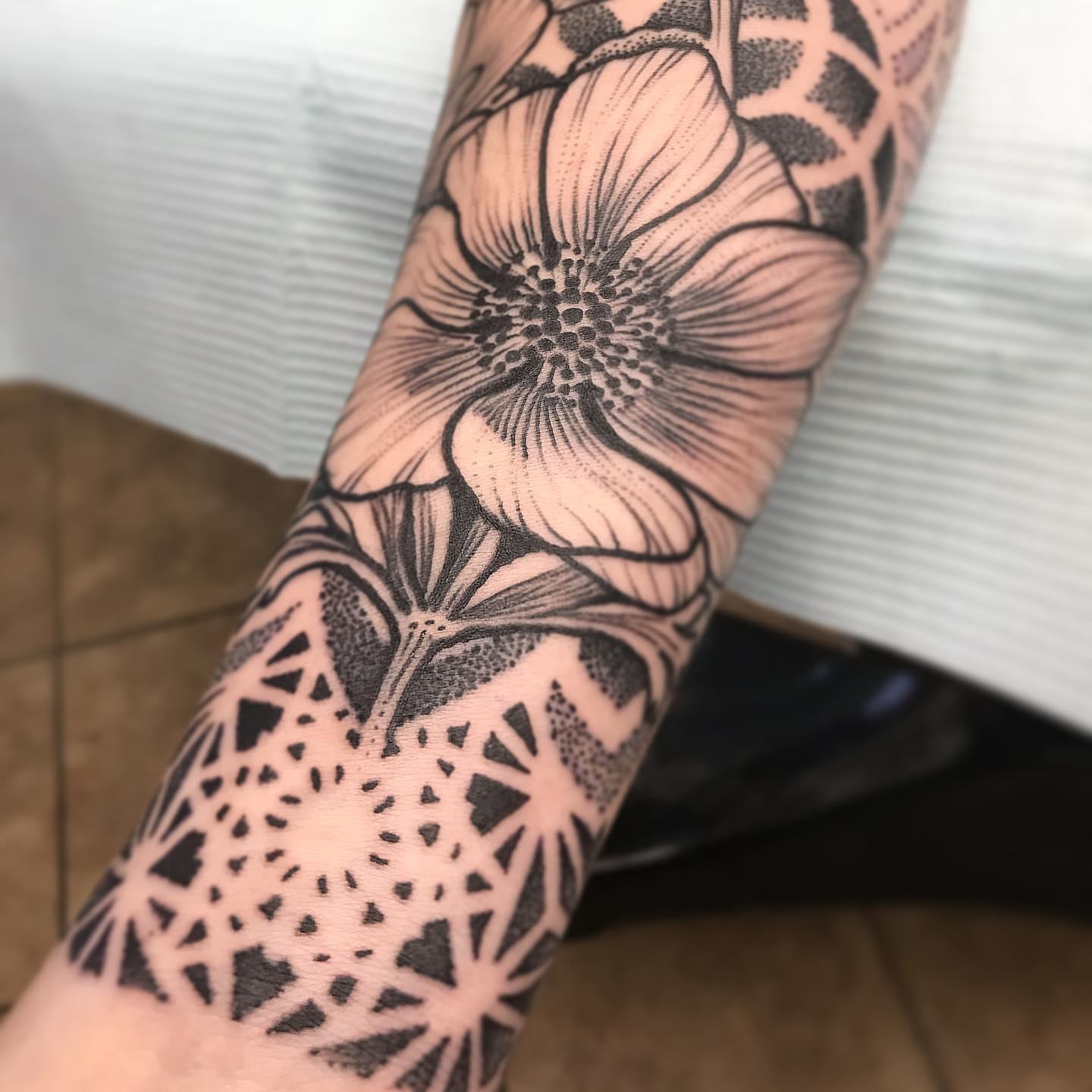 Flower dotwork tattoo on the forearm by Steven Campbell, Kansas City, Missouri