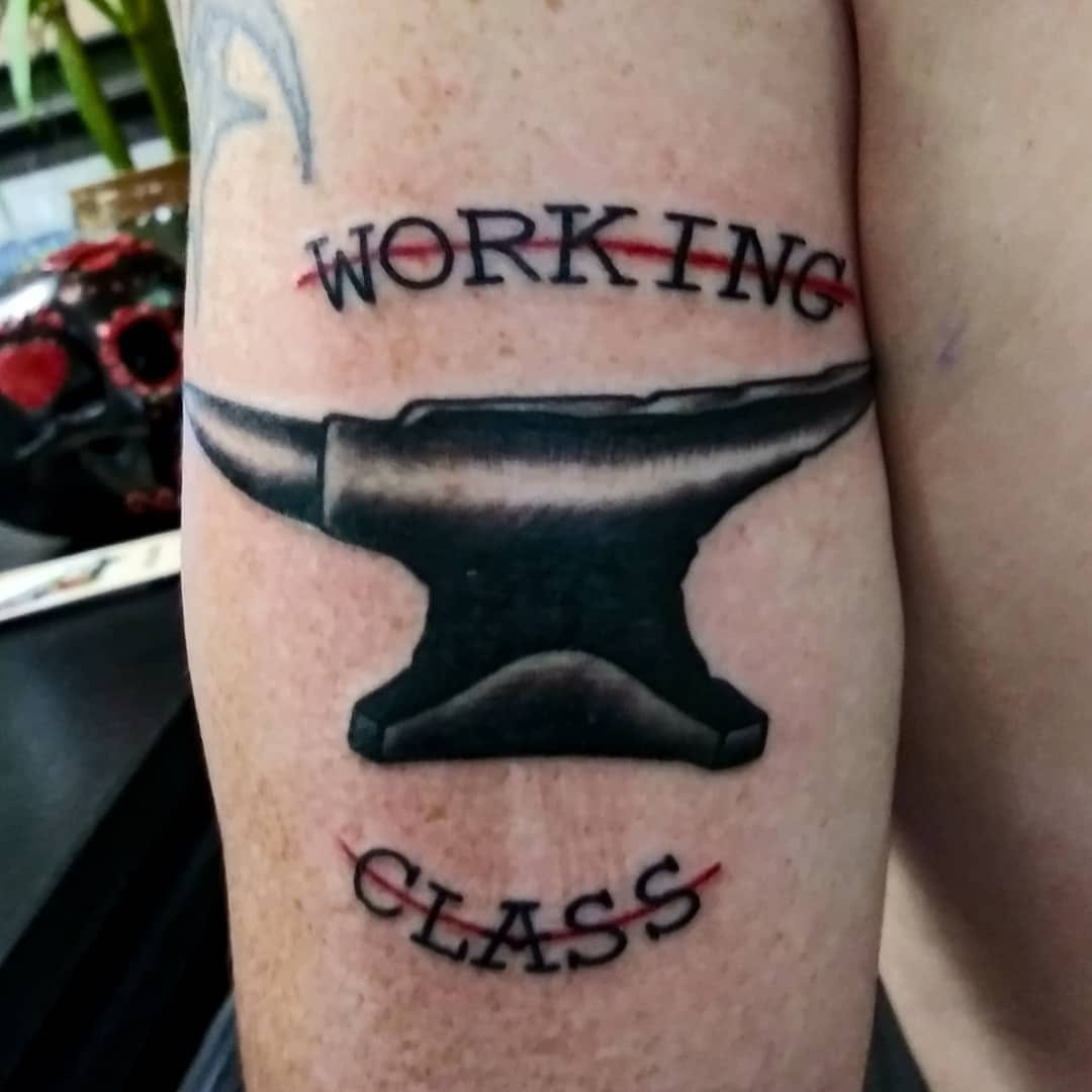 Anvil with text tattoo on the forearm by Dorrough Tattooer