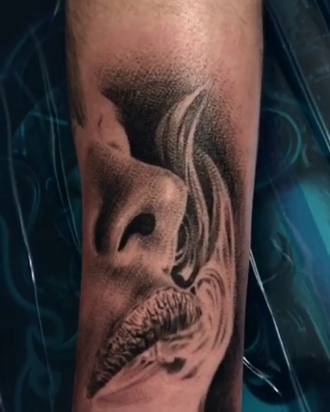 Face smoking realism tattoo by Carlos Macedo Tattoo