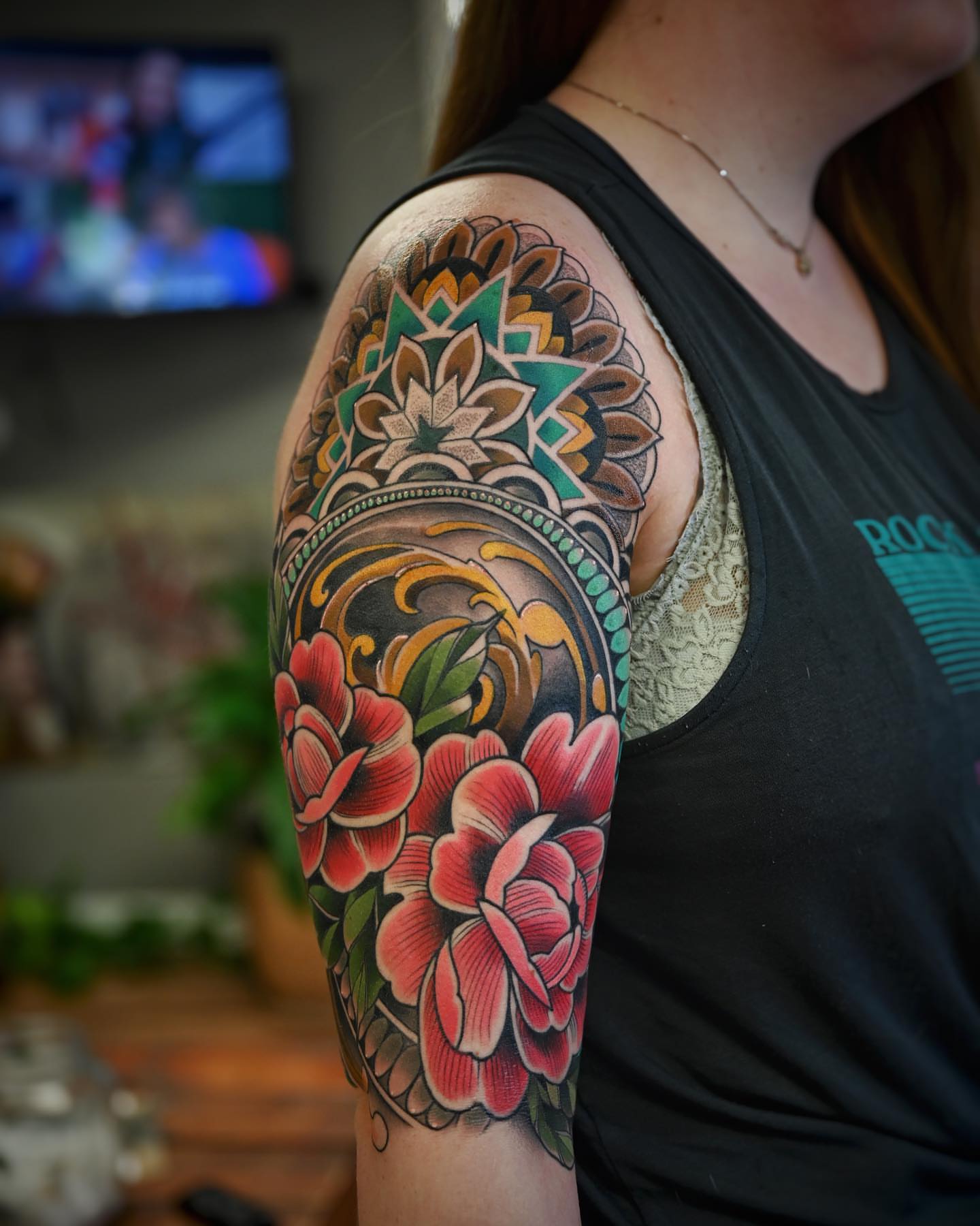 Floral mandala neo-traditional tattoo on the upper arm by Derek Hutchison, Des Moines, Iowa
