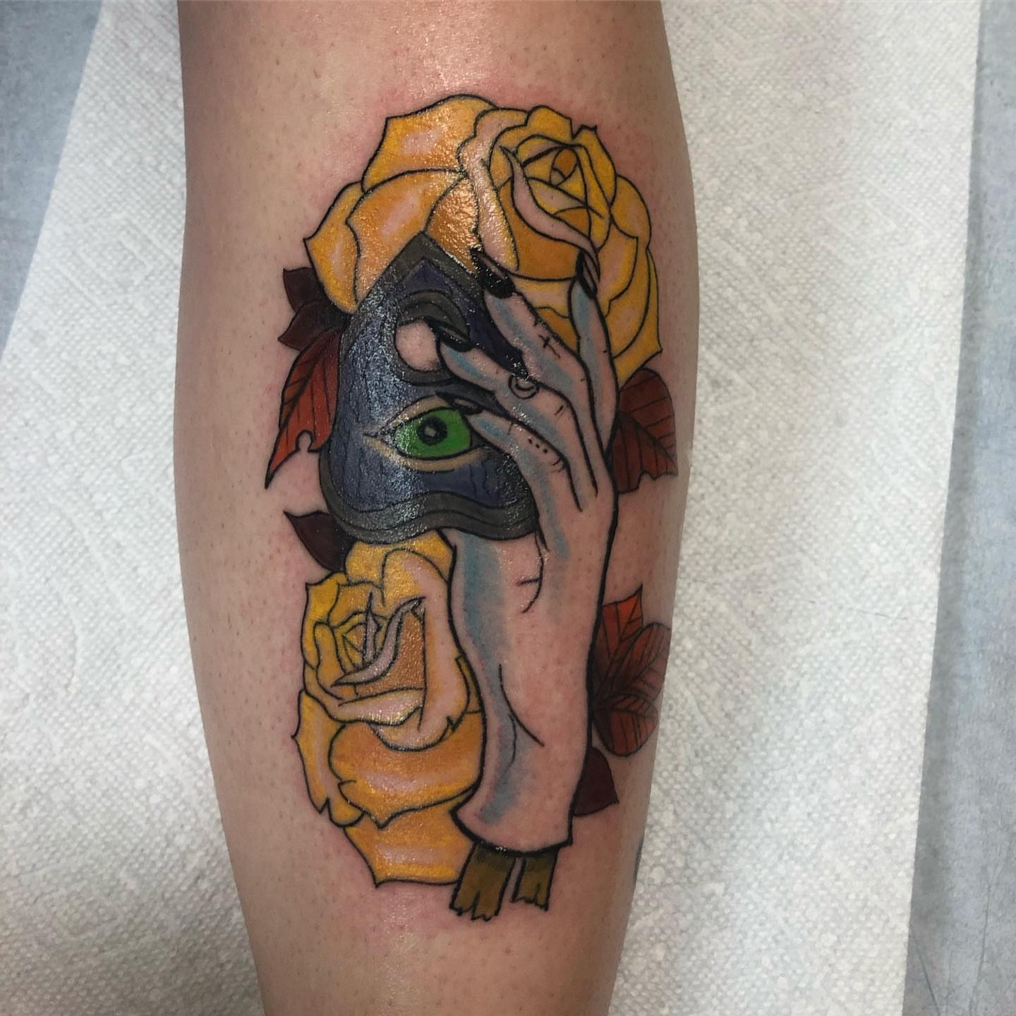 Mask with rose neo-traditional tattoo on the forearm by Sally Darling