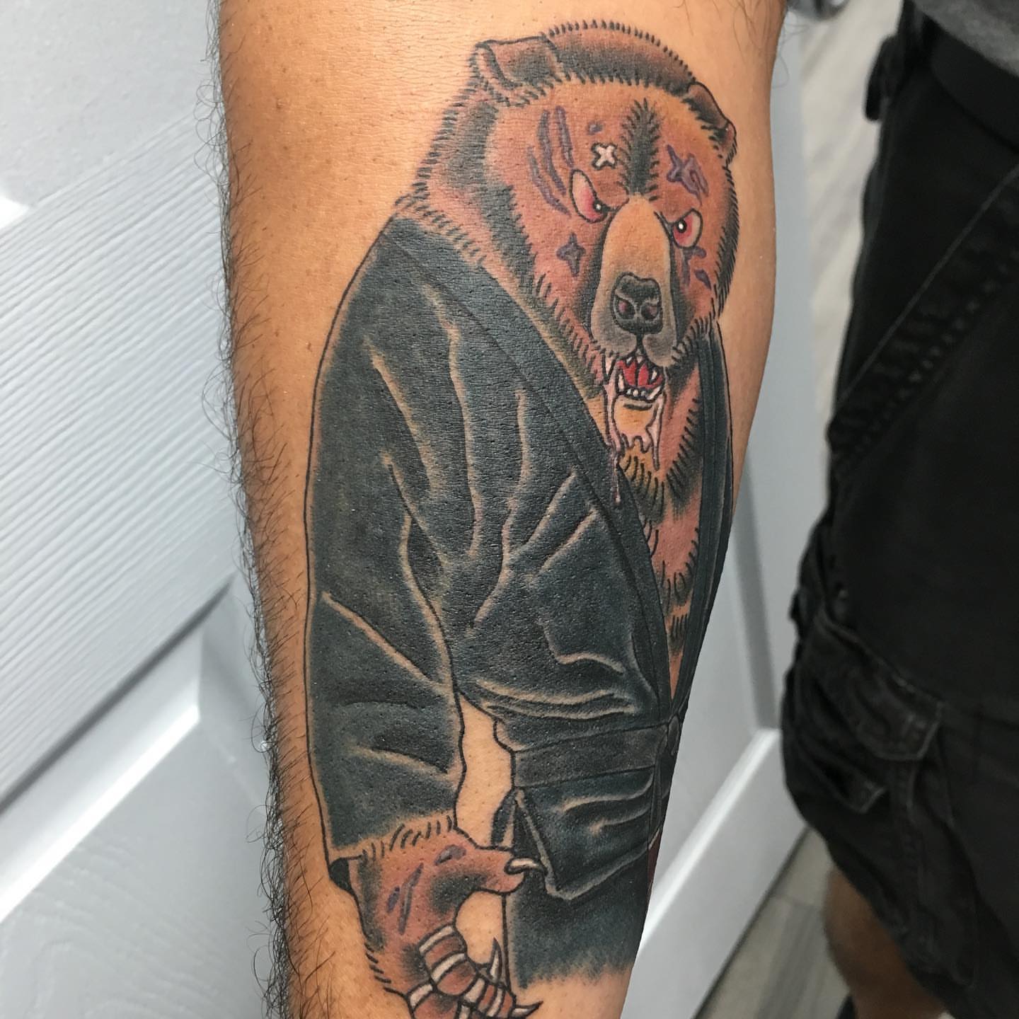 Bear wearing leather jacket realism tattoo on the forearm by Ei Horimiya Omiya