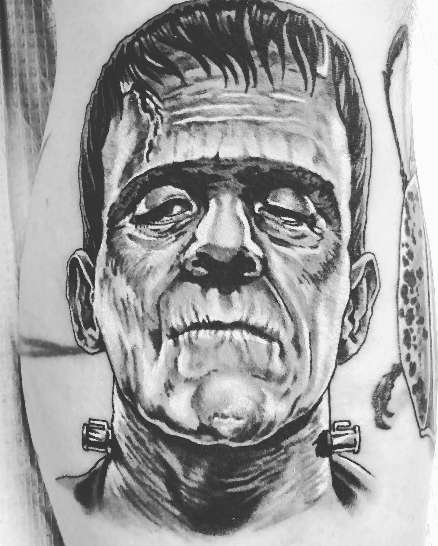Frankenstein's monster black and grey tattoo on the forearm by Mark Johnson [Tattoo Artist]