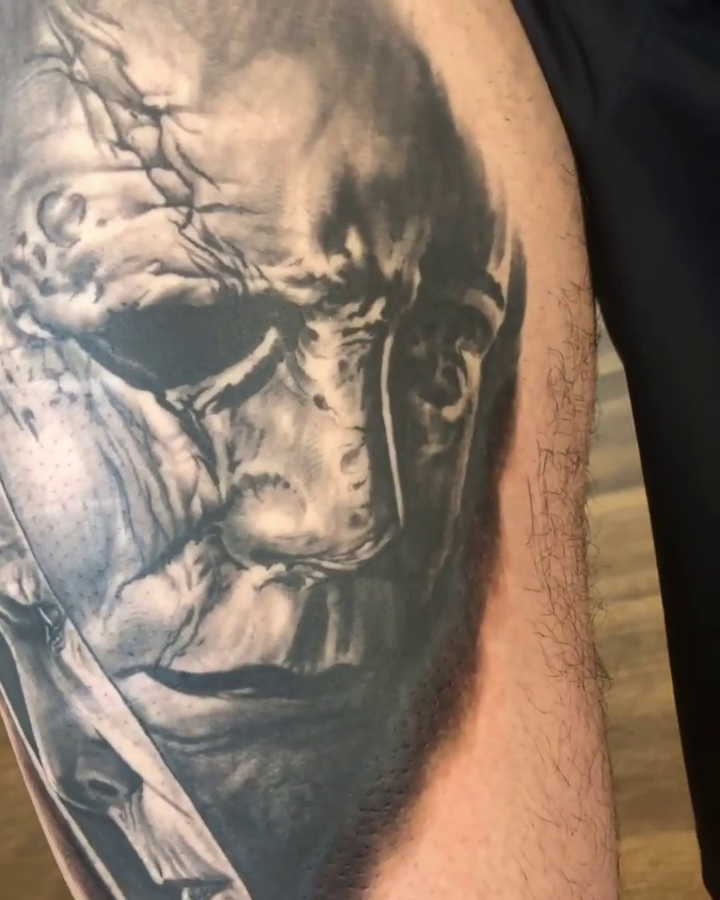 Michael Myers holding a knife realism tattoo by Oak Adams