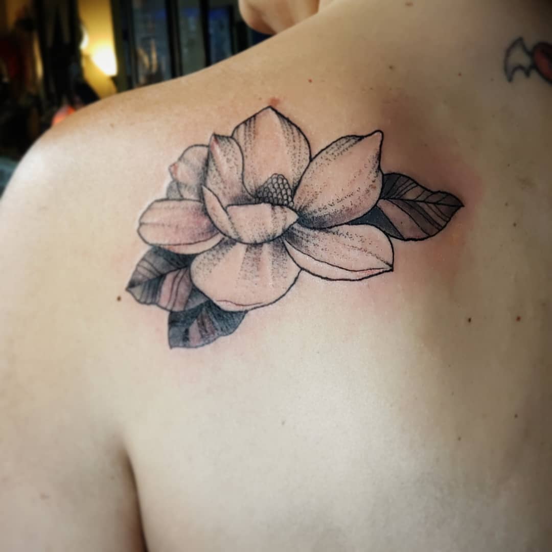 Lotus flower dotwork tattoo on the shoulder by Kayla Linton