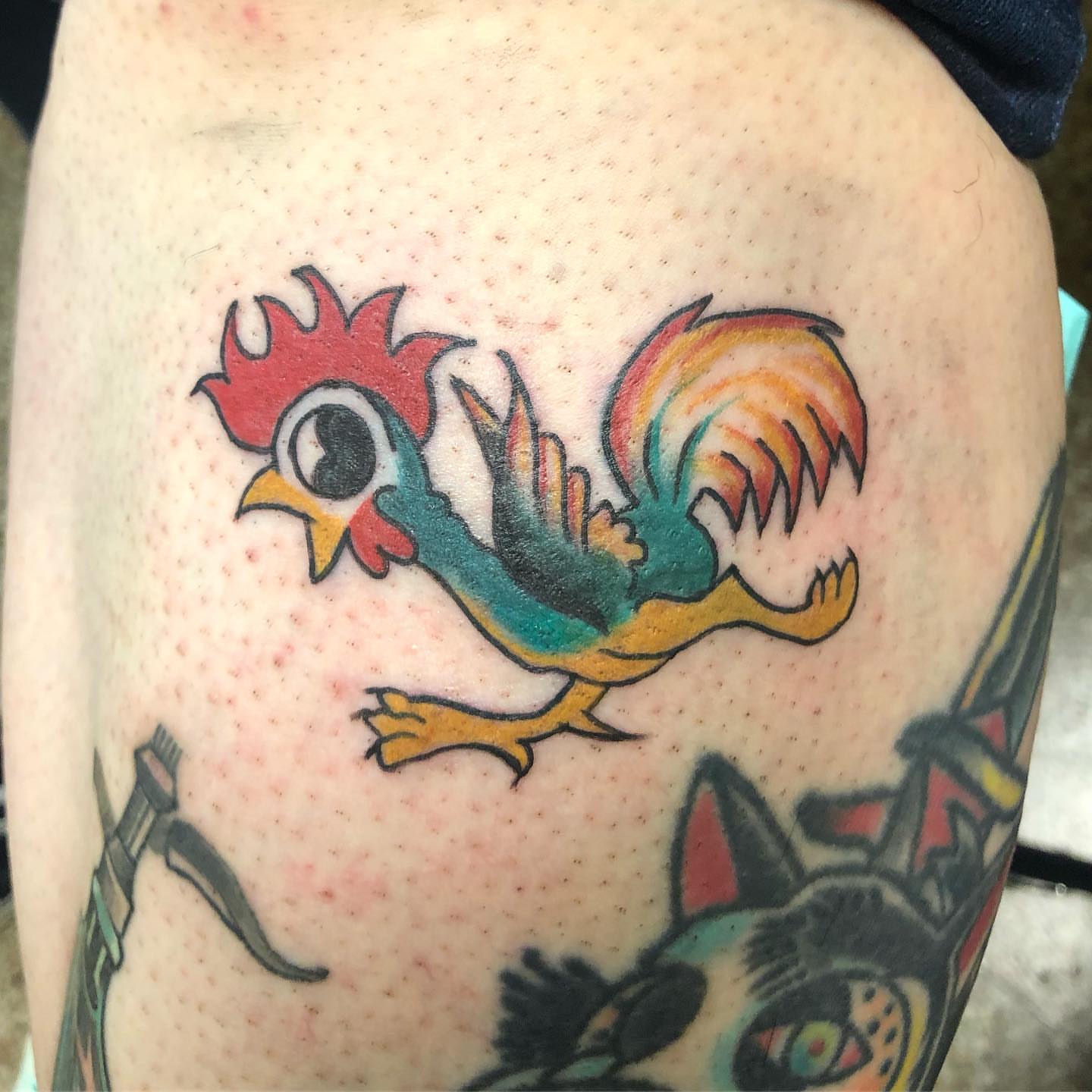 Rooster American traditional tattoo on the thigh by Sally Darling