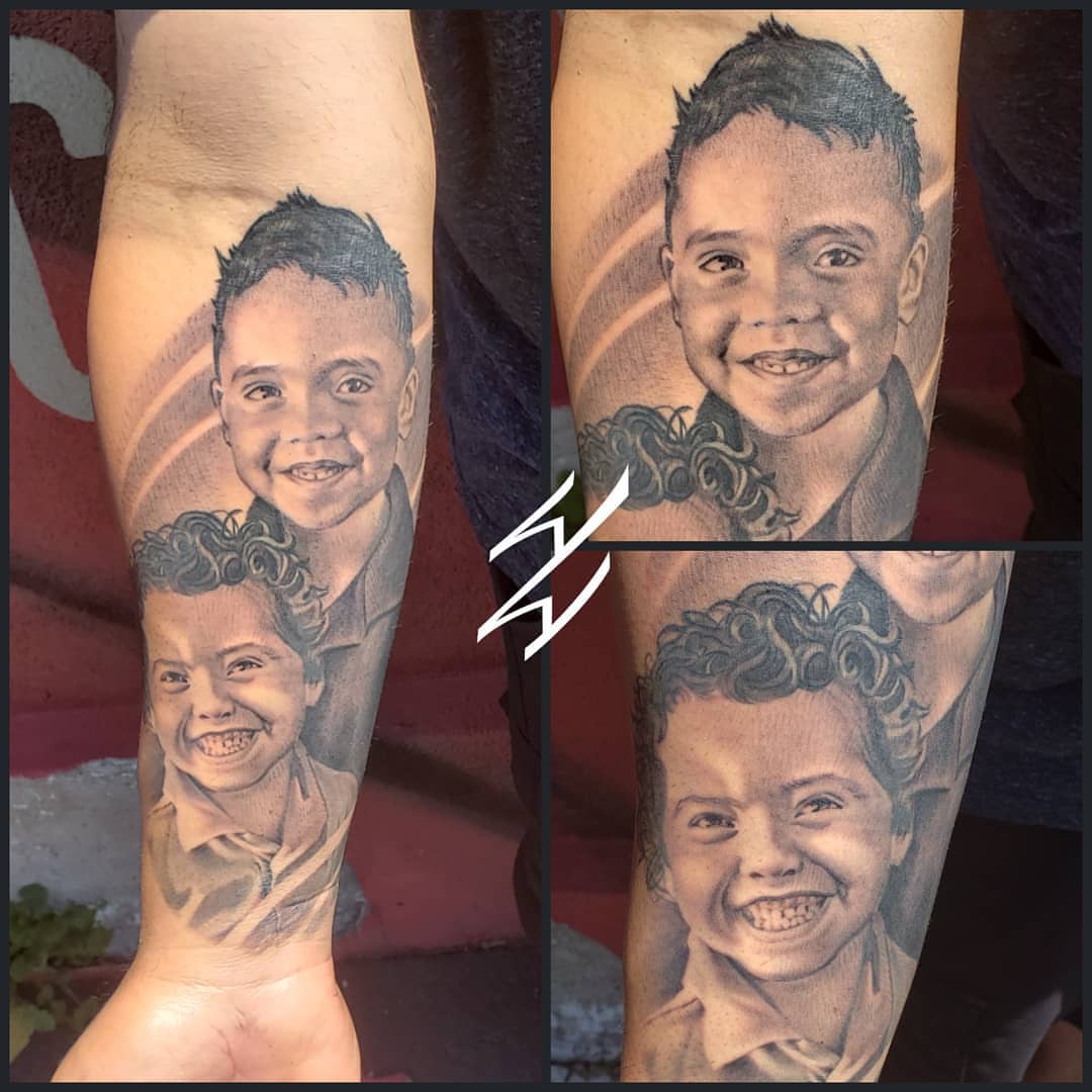 Child's face realism tattoo on the forearm by Walt Watts, Salt Lake City, Utah