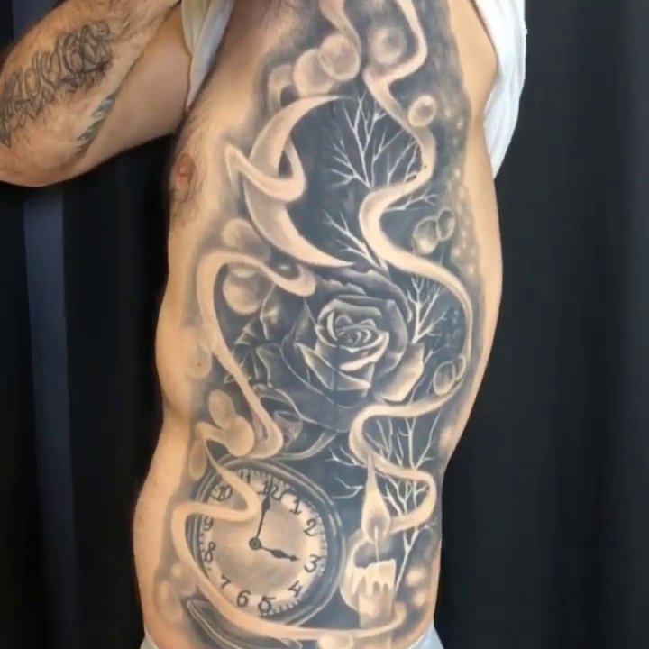 Rose and clock with smoke realism tattoo by Charlie Soto