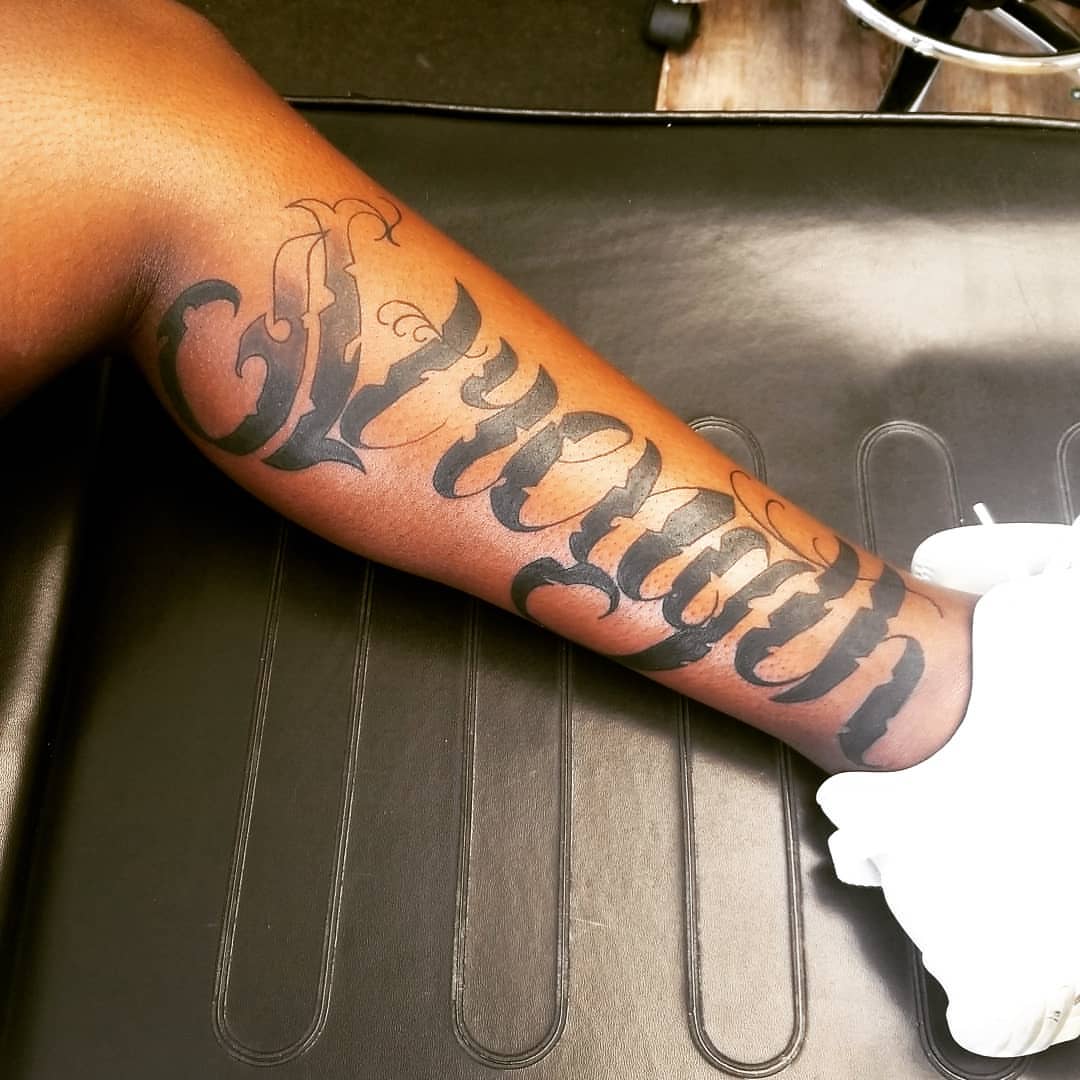 Script lettering lettering script tattoo on the forearm by André Brazil