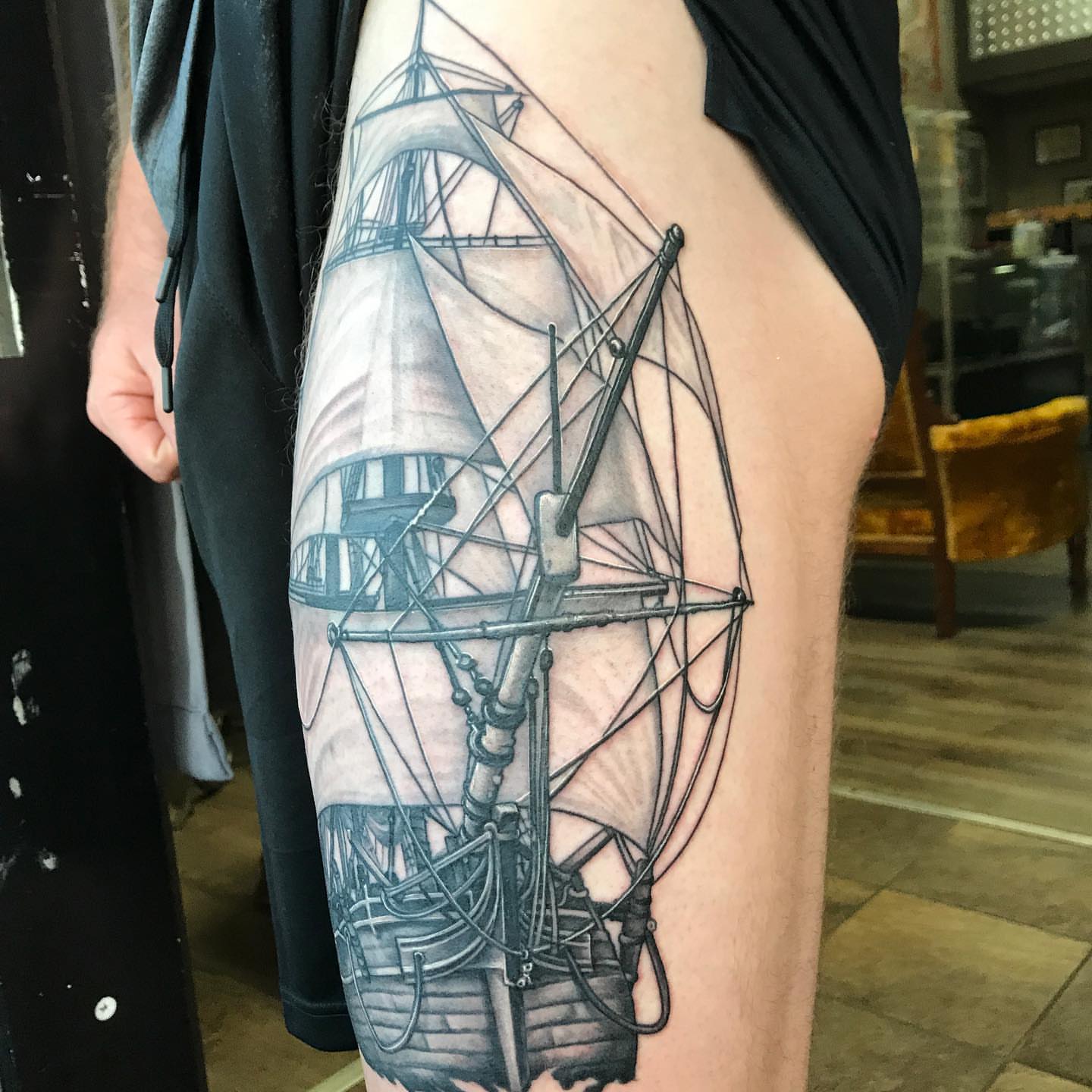 Ship realism tattoo on the thigh by Dustin Lane Collins
