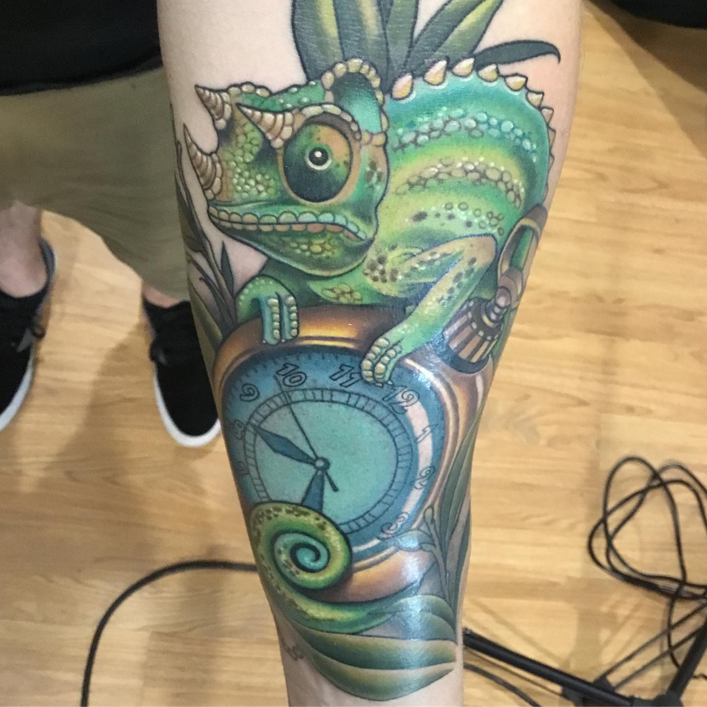 Chameleon and clock realism tattoo on the forearm by Ariel Robinson