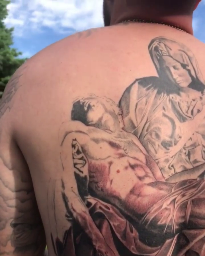 The Pietà realism tattoo by Carlos Macedo Tattoo