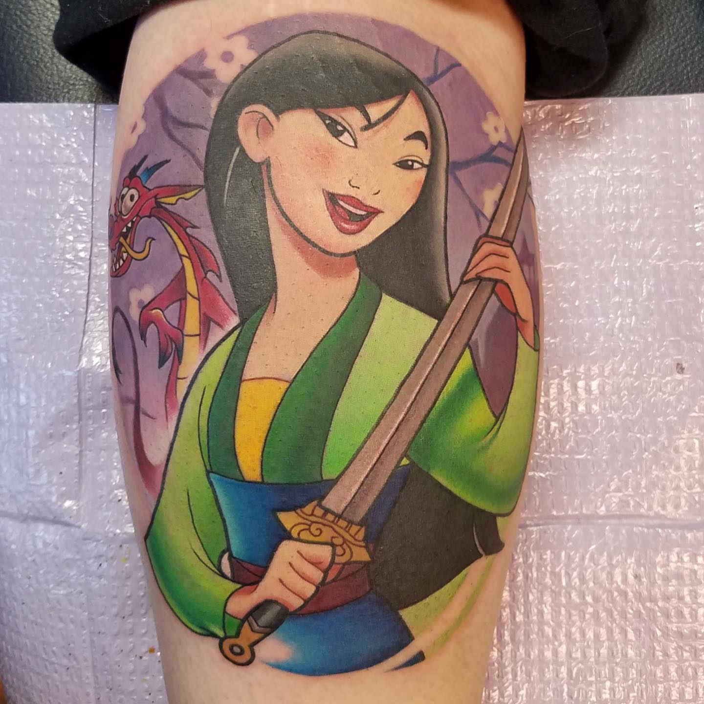 Mulan illustrative tattoo on the thigh by Ariel Robinson