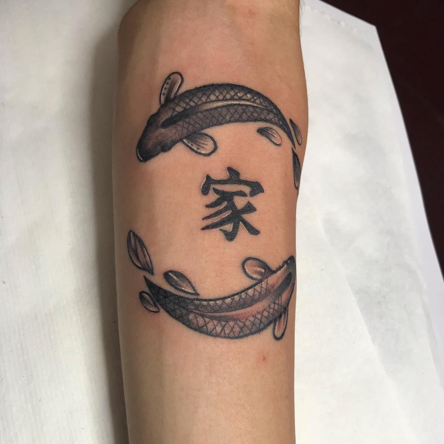 Koi fish and kanji black and grey tattoo on the forearm by Felix perez (Tattooer)