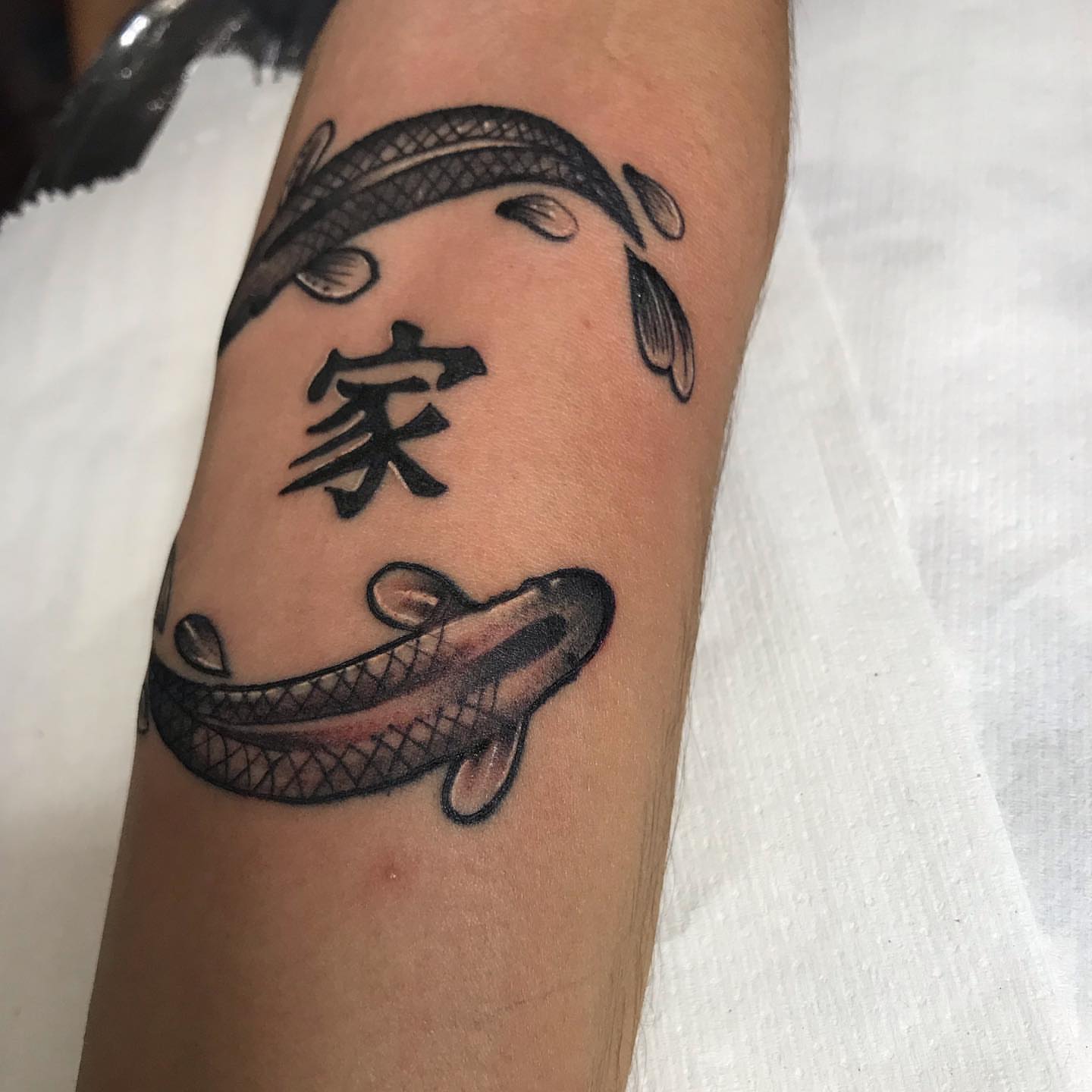 Koi fish and kanji black and grey tattoo on the forearm by Felix perez (Tattooer)