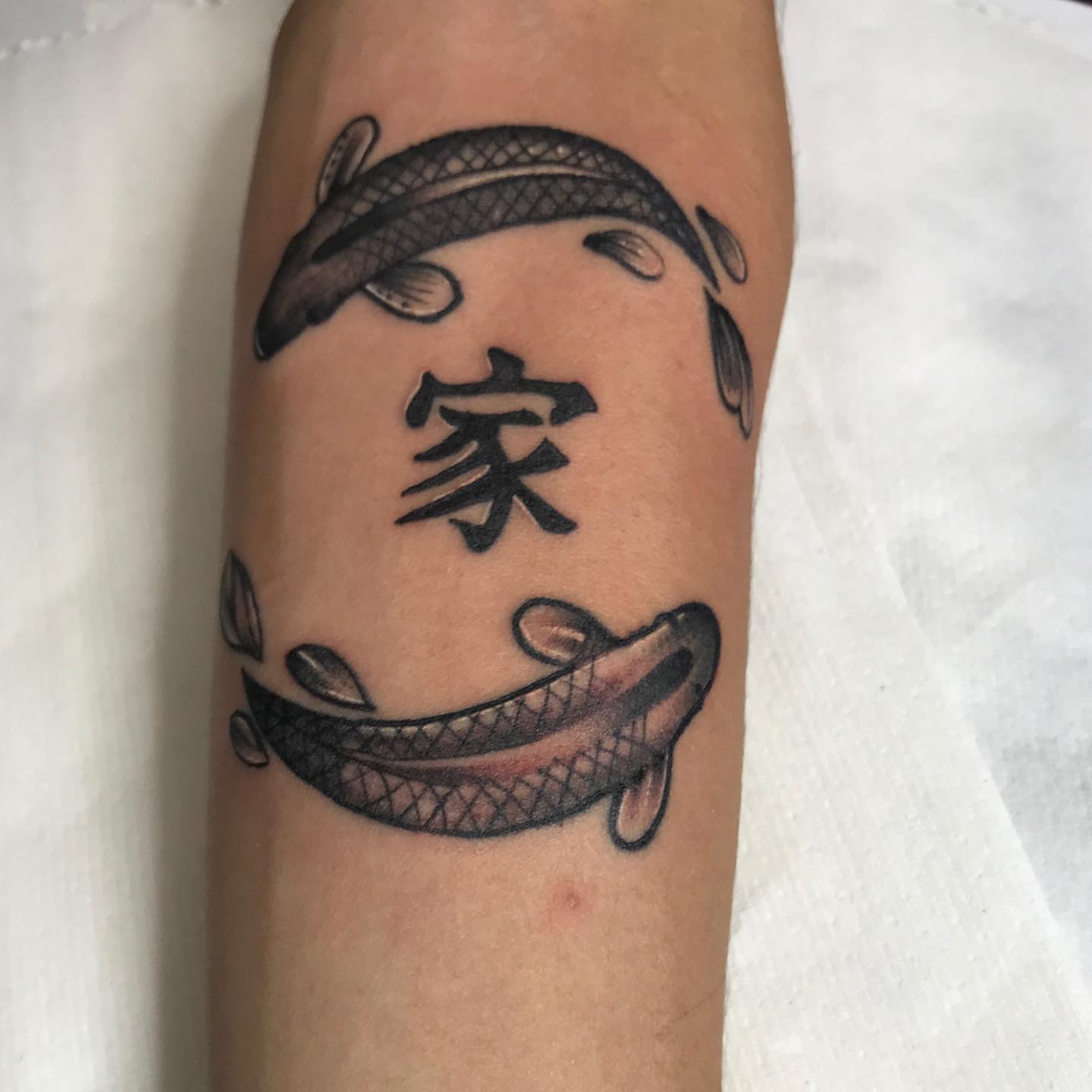 Koi fish and kanji black and grey tattoo on the forearm by Felix perez (Tattooer)