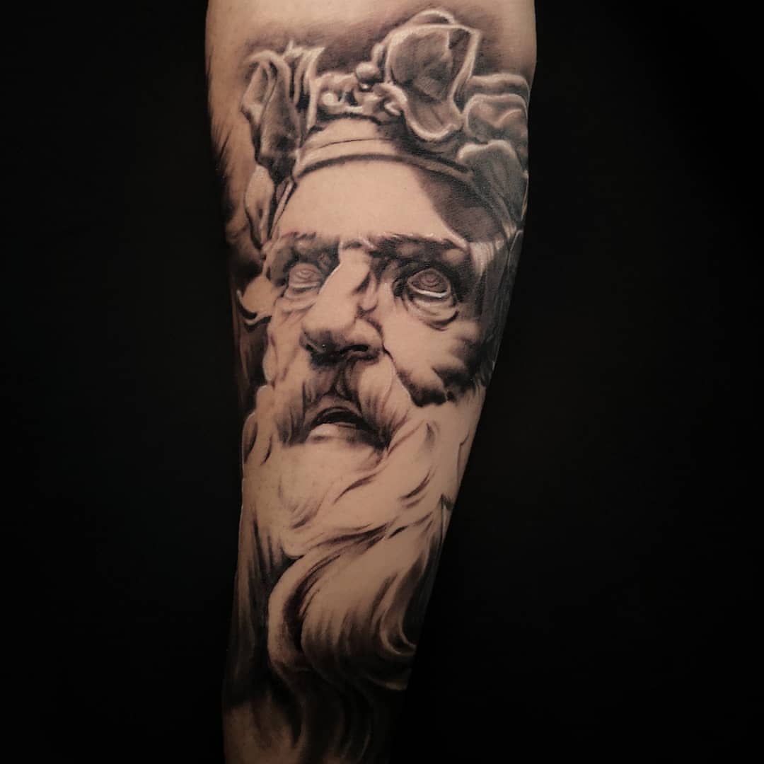 Ancient figure realism tattoo on the forearm by Lindsay