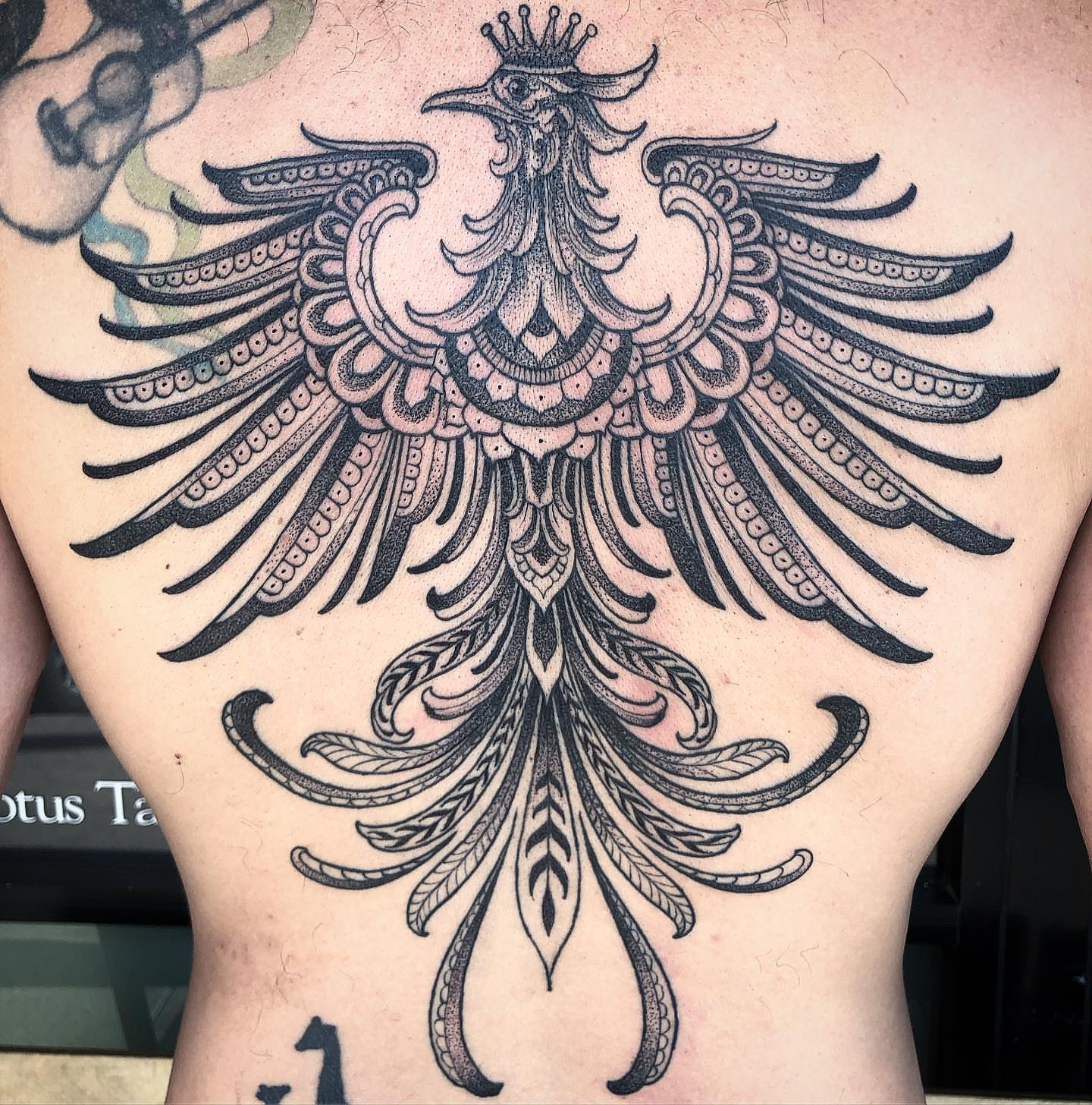 Phoenix ornamental tattoo on the back by Byron Winkelman, Gilbert, Arizona