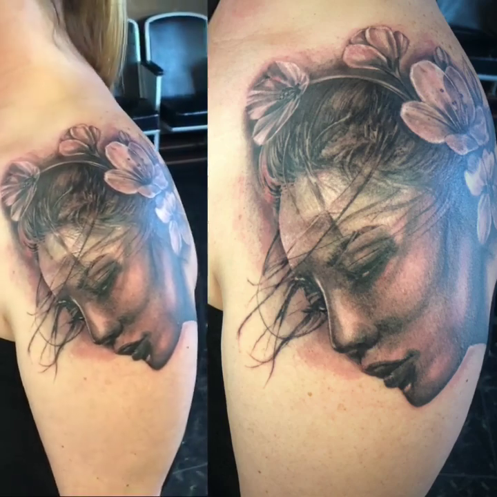 Woman with flowers realism tattoo by GABRIELExTATTOOS