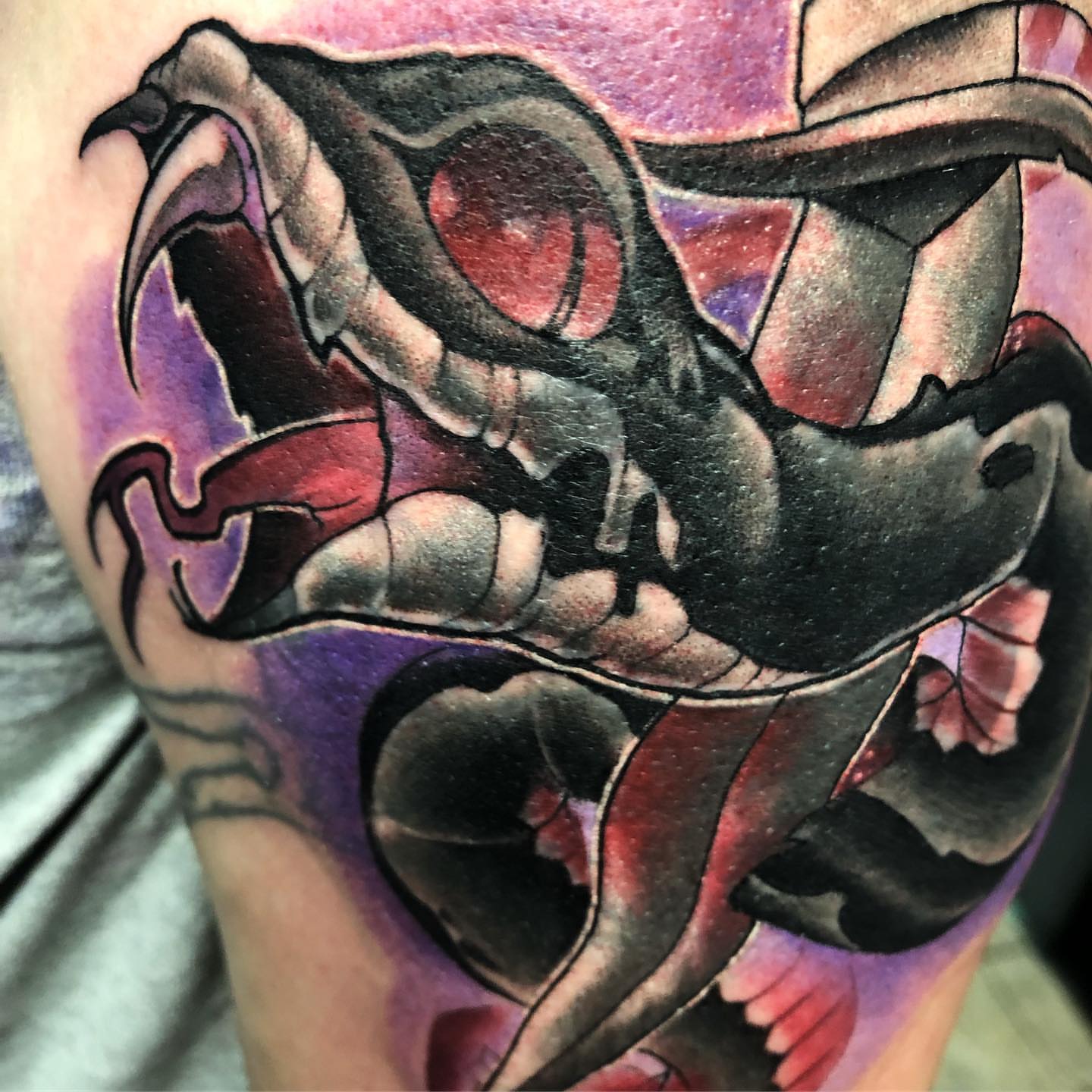Dragon dark realism tattoo on the thigh by Saint Jimmy