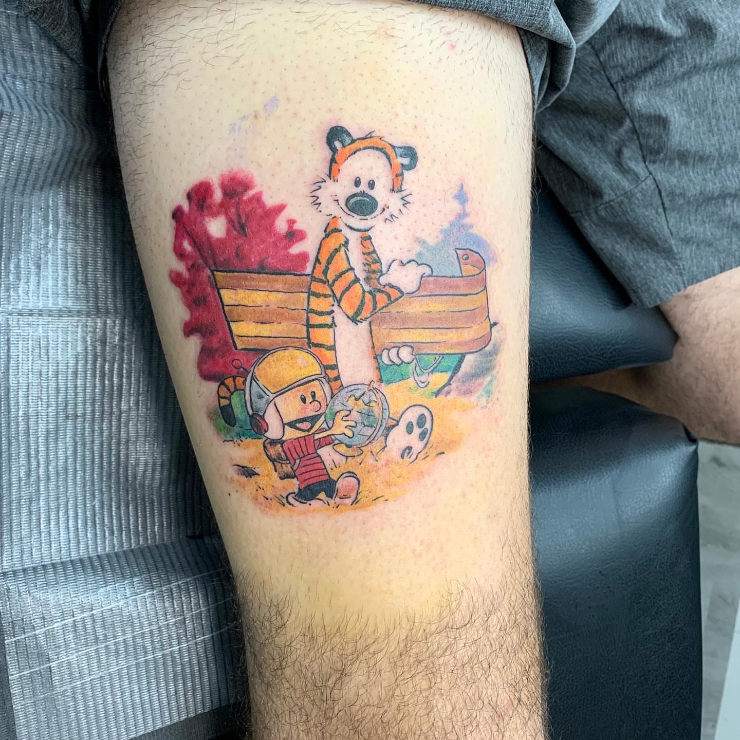 Calvin and Hobbes dotwork tattoo on the thigh by Trevor Sibary
