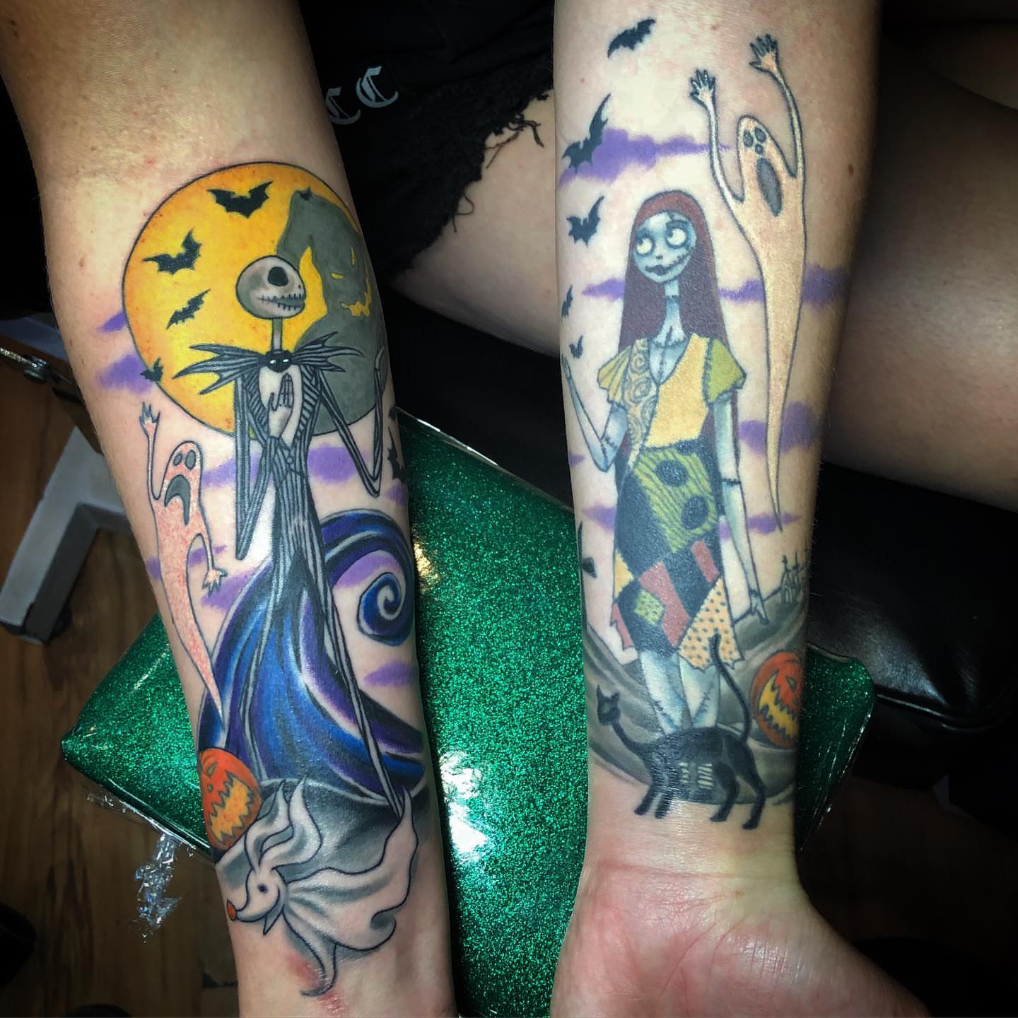 Jack Skellington and Sally dark realism tattoo on the forearm by alexandra