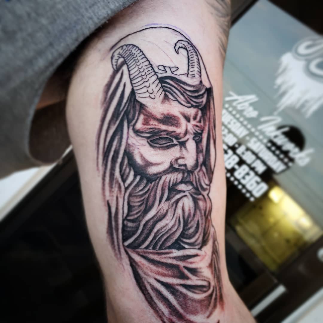 God-like figure realism tattoo on the forearm by Kayla Linton