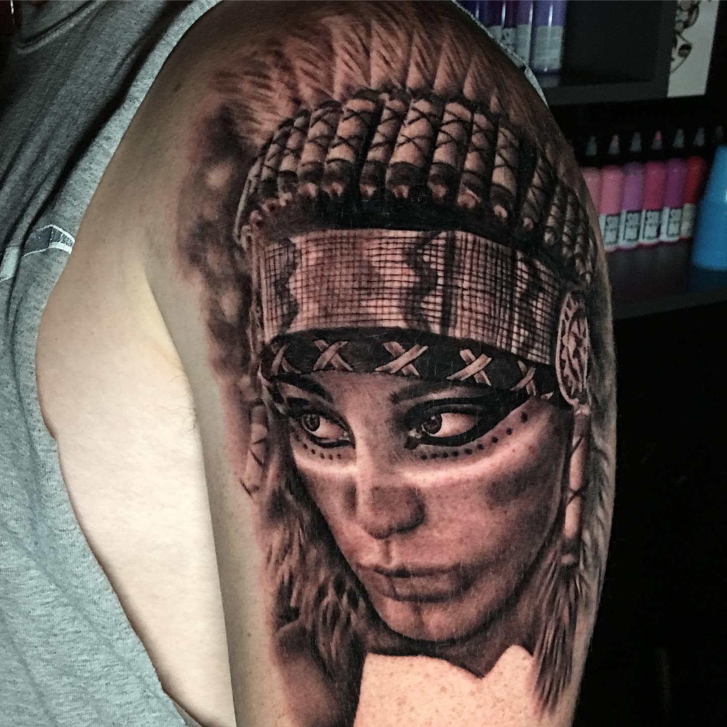 Woman with braids realism tattoo on the shoulder by Dalton King Pensacola Tattooer