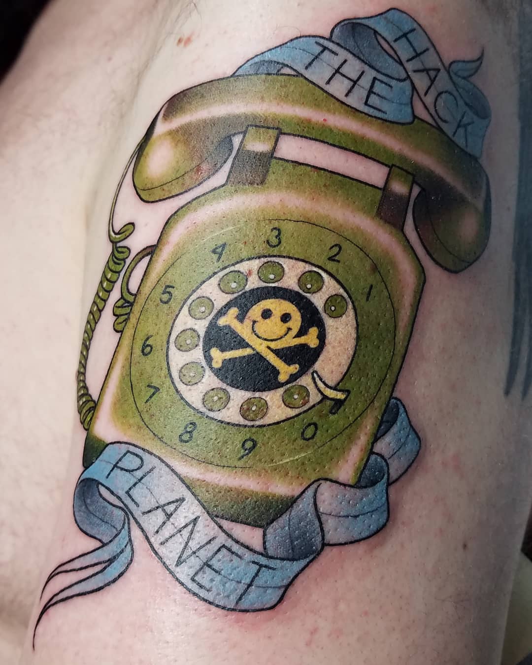 Rotary phone American traditional tattoo on the upper arm by @jaclyngreb