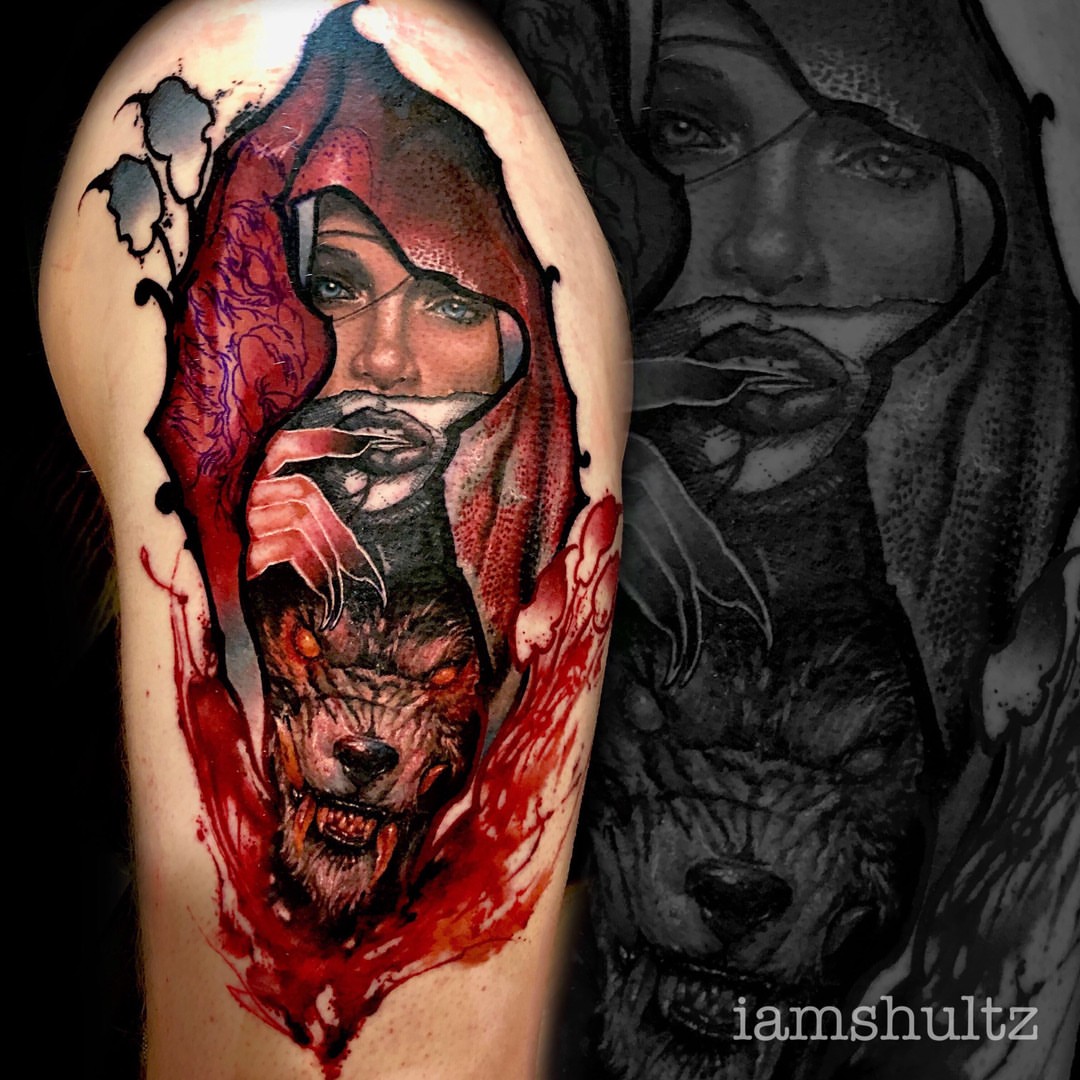 Woman with wolf dark realism tattoo on the forearm by Mike Shultz