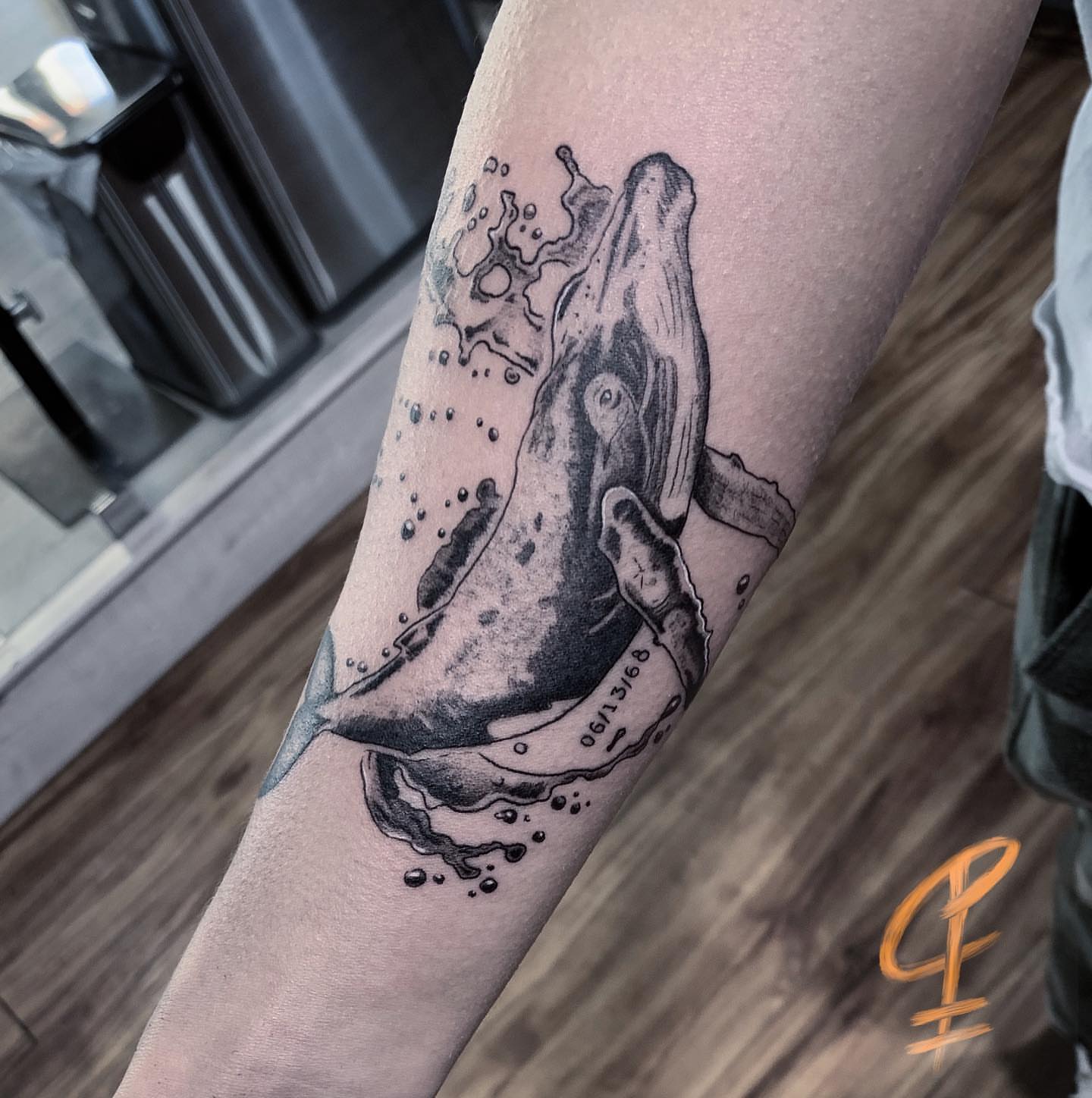 Whale black and grey tattoo on the forearm by Christian Pelaez