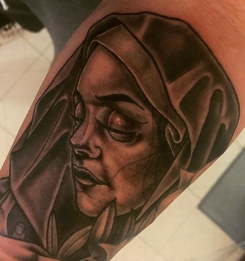 Woman wearing hijab realism tattoo on the forearm by Tattoos By Rico