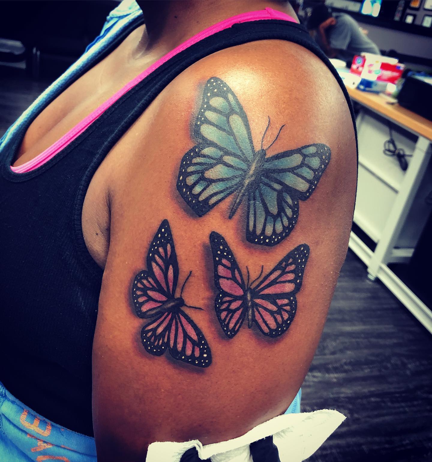 Butterflies realism tattoo on the shoulder by Tattoos By Rico