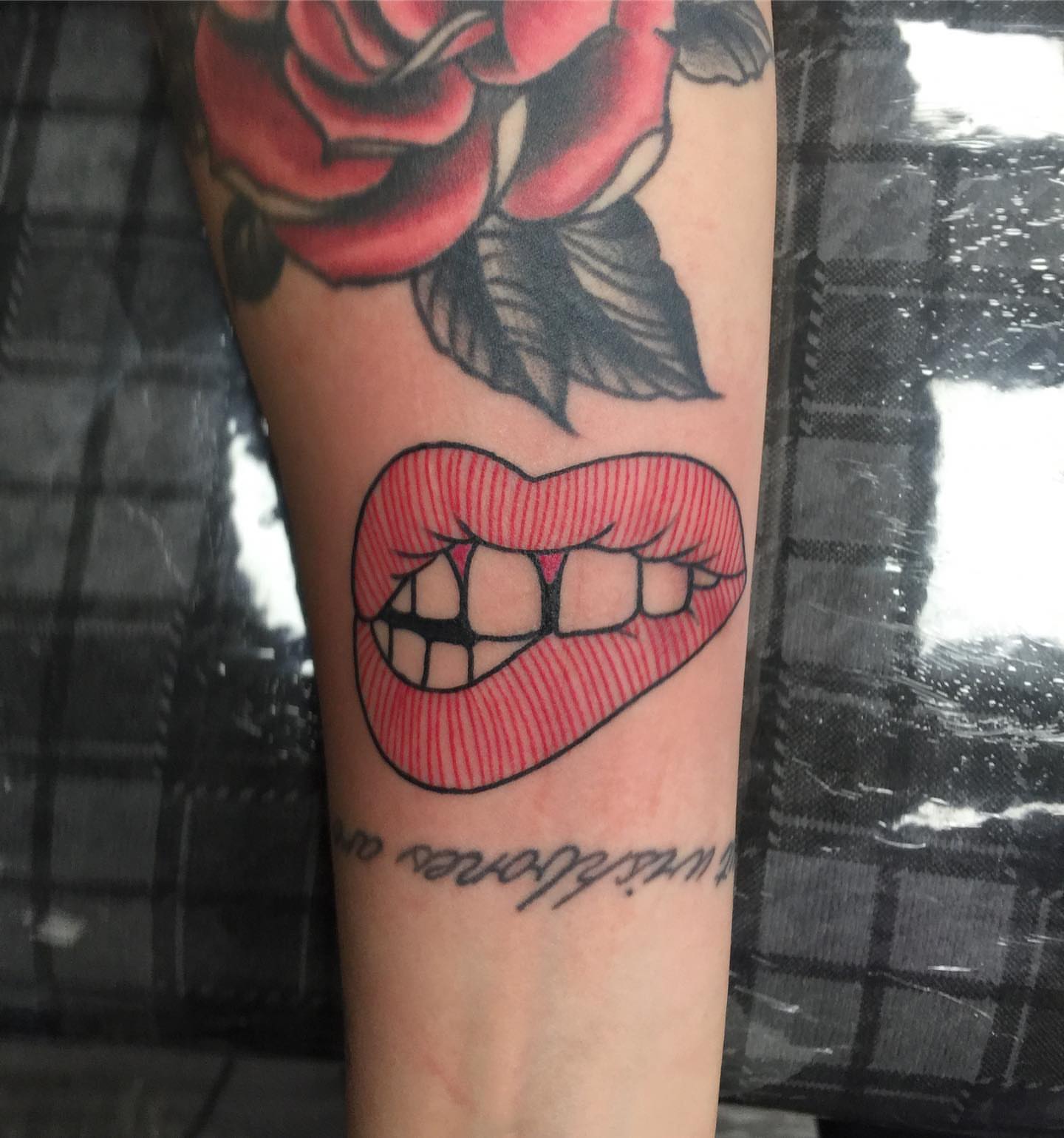 Lips American traditional tattoo on the forearm by Tattoos By Rico