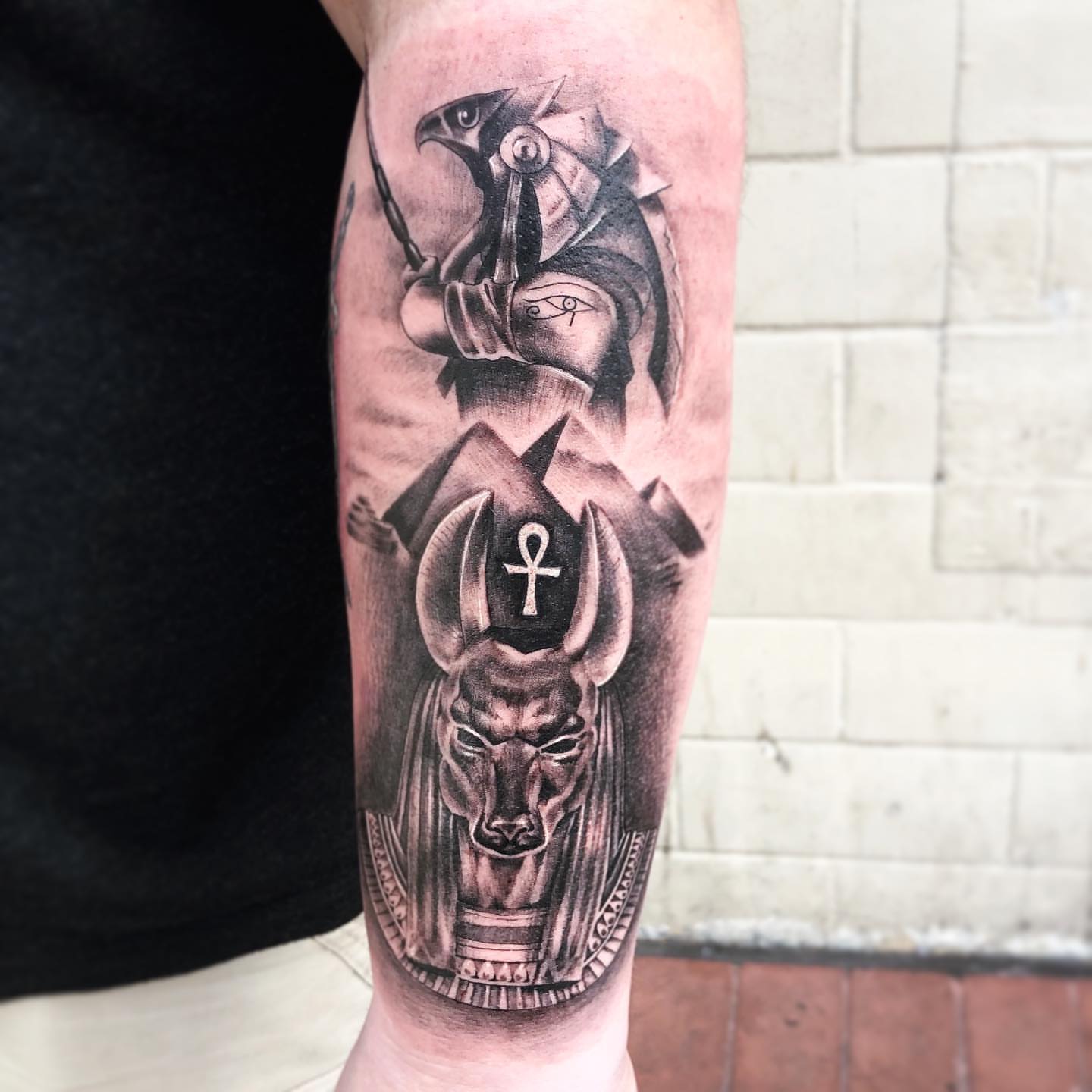 Ancient Egyptian deities realism tattoo on the forearm by Madison Ast Tattoo