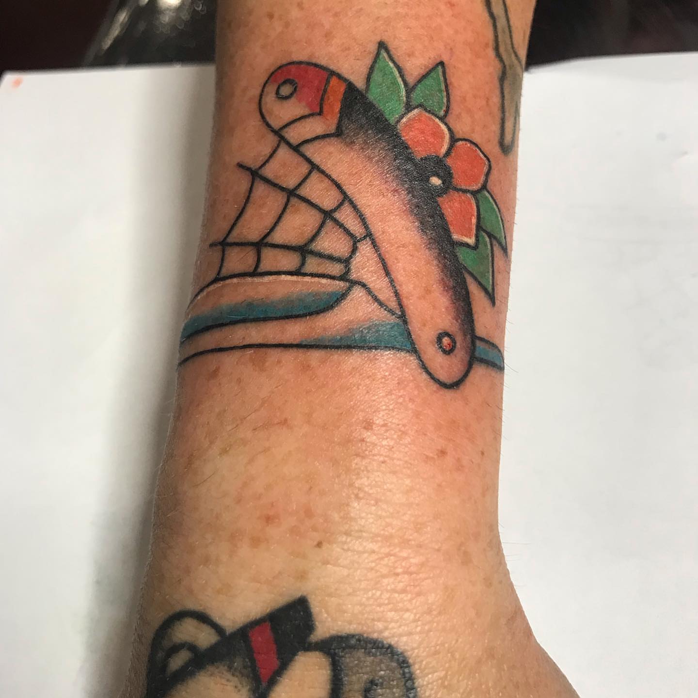 Fish and flower American traditional tattoo on the forearm by Felix perez (Tattooer)