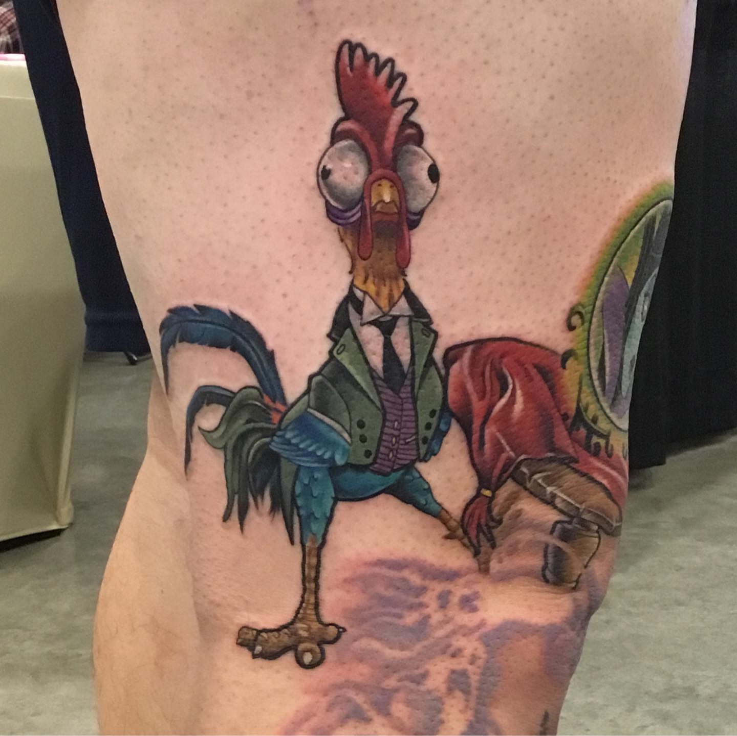 Rooster in suit realism tattoo on the thigh by Ariel Robinson