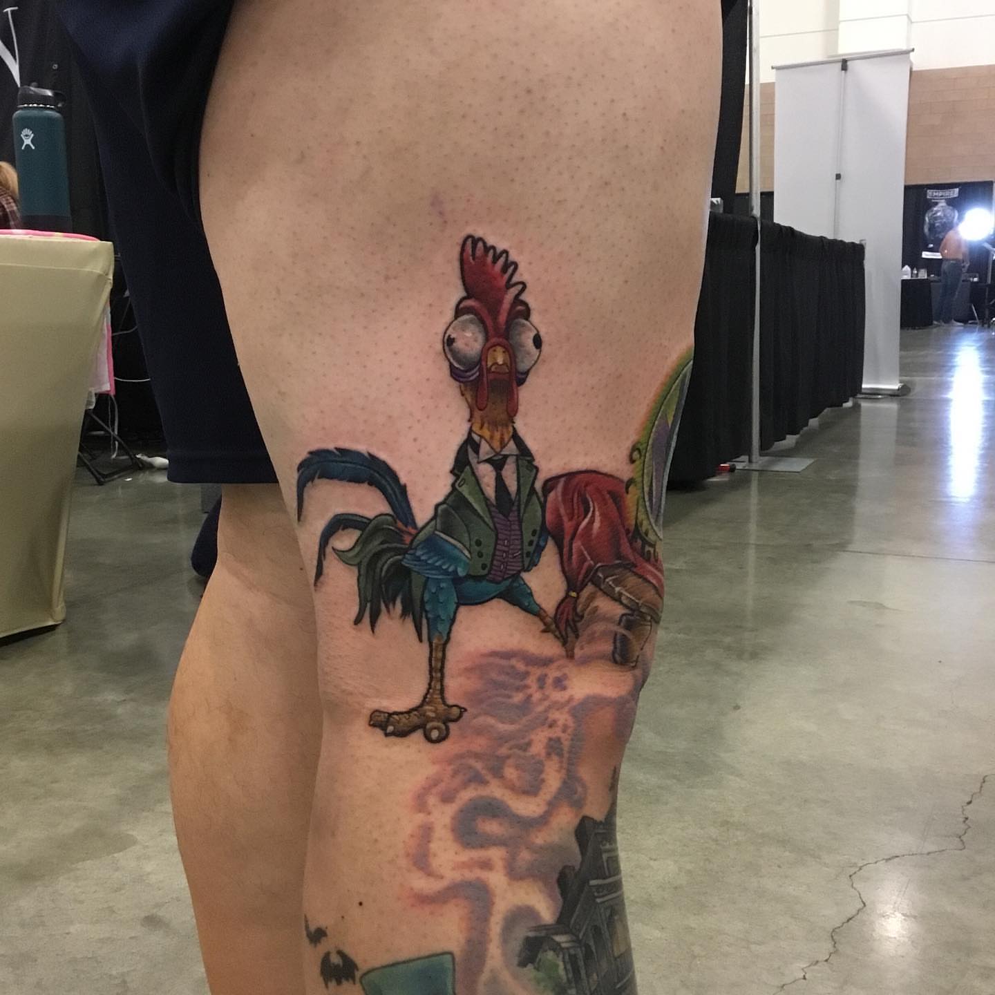 Rooster in suit realism tattoo on the thigh by Ariel Robinson