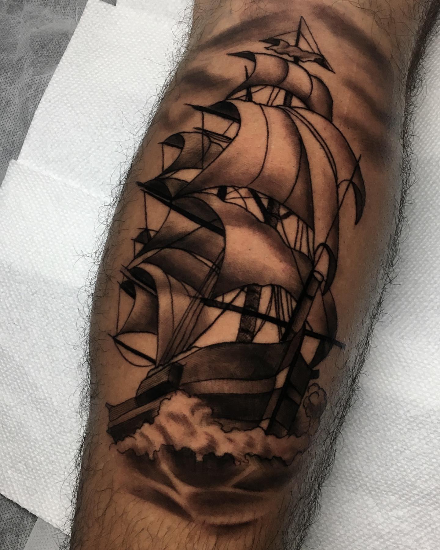 Sailboat black and grey tattoo on the forearm by Dalton King Pensacola Tattooer