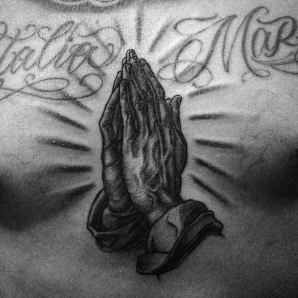 Praying hands black and grey tattoo on the chest by π π π β π π π π