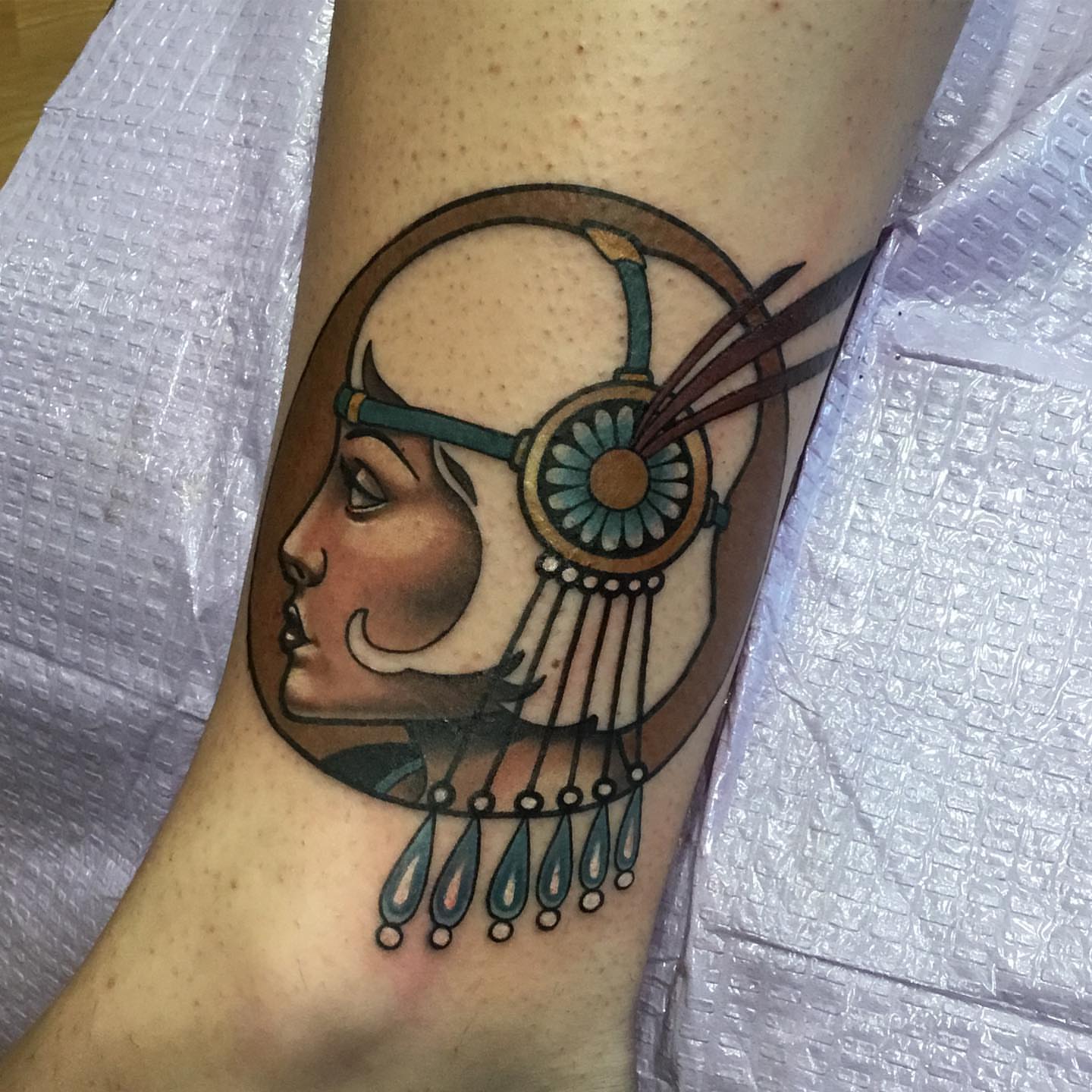 Woman with headphones American traditional tattoo on the forearm by Ariel Robinson