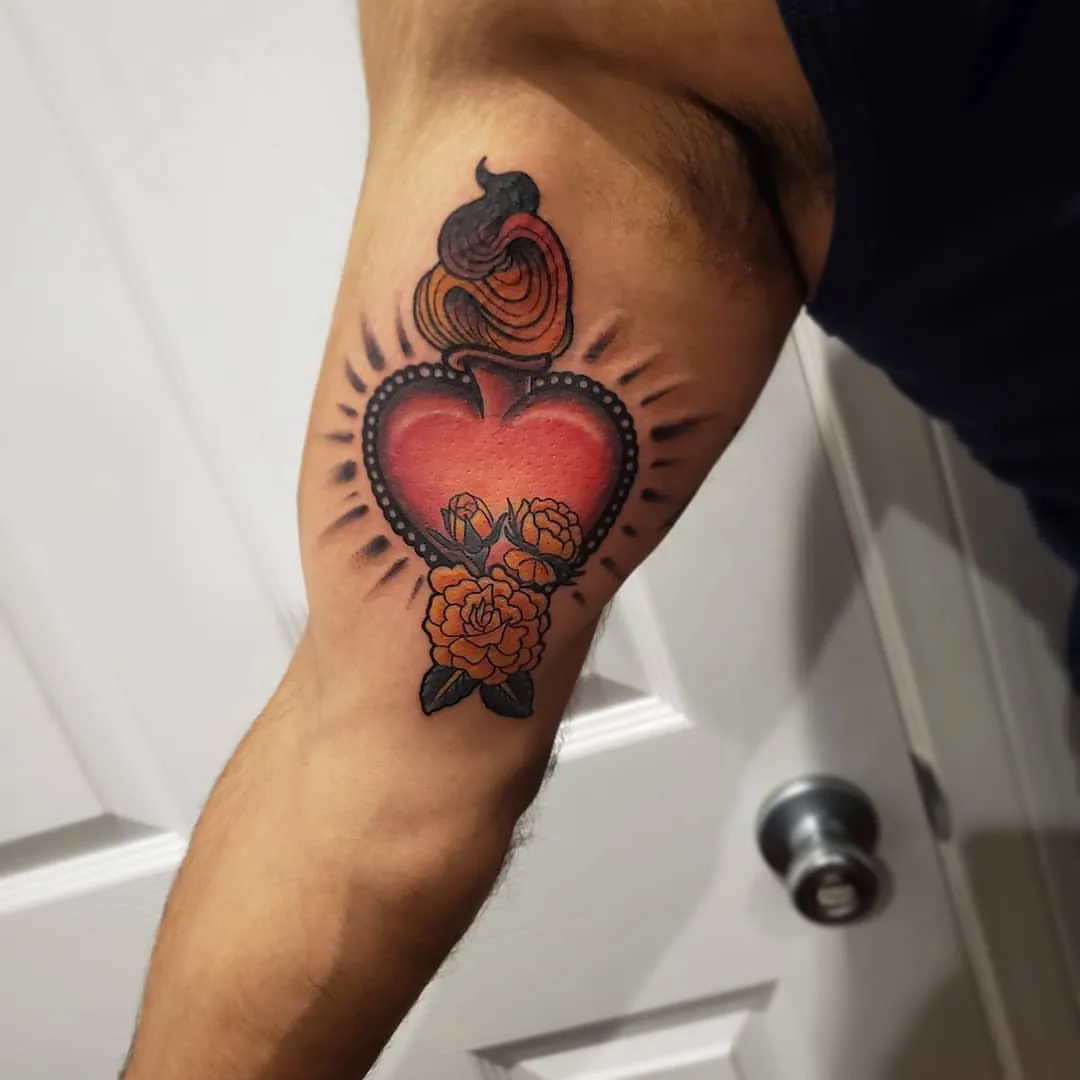 Heart with roses American traditional tattoo on the forearm by David Xavier Jimenez
