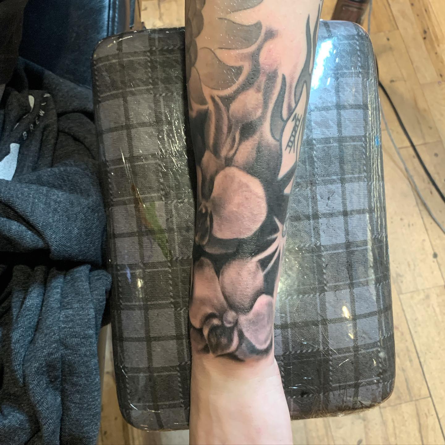 Muscular figure realism tattoo on the forearm by Jeff Kees