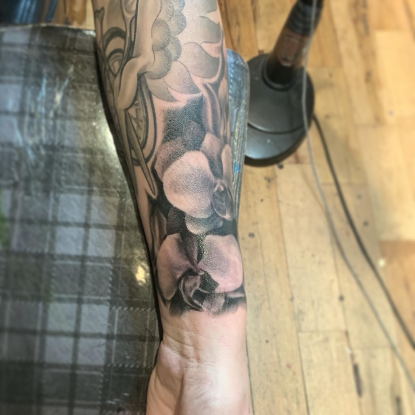 Bone structure black and grey tattoo on the forearm by Jeff Kees