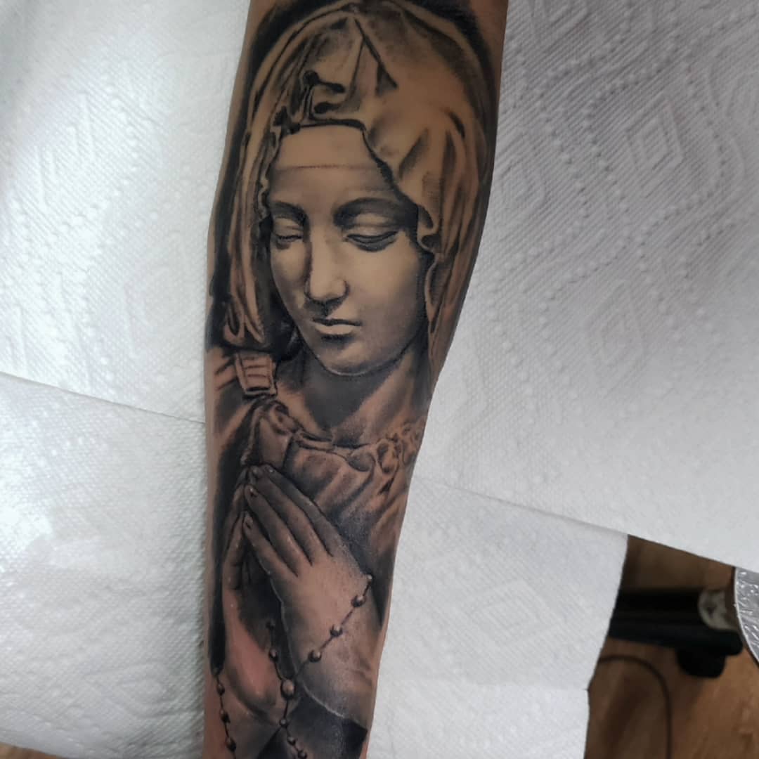 Praying woman realism tattoo on the forearm by Greg West Sac tattoo artist, West Sacramento, California