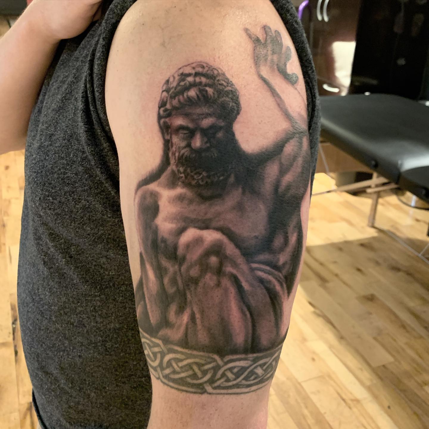 Statue of a bearded man realism tattoo on the forearm by Jeff Kees